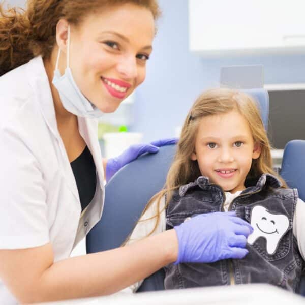 A happy child with a dentist