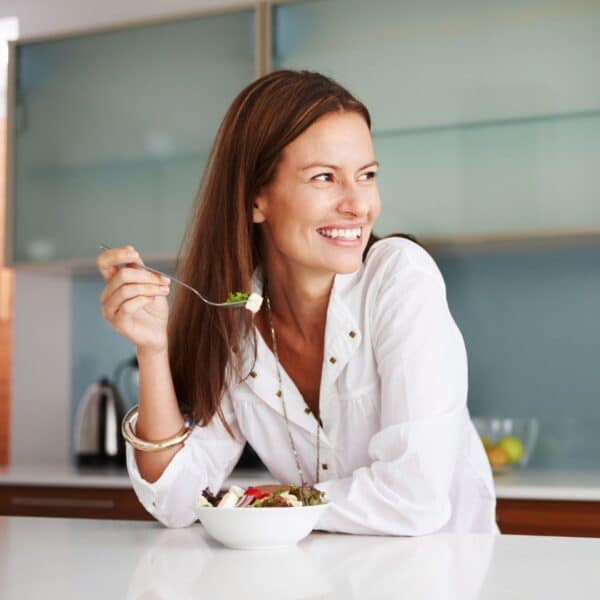 women smiling and eating at counter